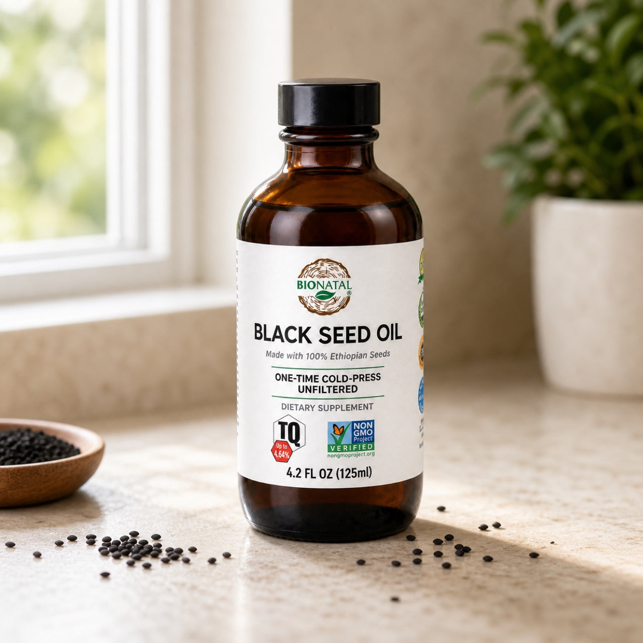 4.2 oz BioNatal black seed oil bottle on a kitchen counter